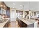 Spacious kitchen with granite counters, stainless appliances, large island, and hardwood flooring at 22268 E Hidden Trail Dr, Parker, CO 80138