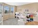 Bright office space with a large window, desk, and storage units at 22268 E Hidden Trail Dr, Parker, CO 80138
