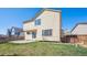 View of a backyard featuring a lawn, patio, and siding; great for relaxation and outdoor activities at 4965 Collinsville Pl, Highlands Ranch, CO 80130