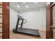 Basement workout room featuring a treadmill, carpeted flooring and ample space for exercise equipment at 4965 Collinsville Pl, Highlands Ranch, CO 80130