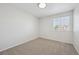 Bright, carpeted bedroom with a window offering ample natural light at 4965 Collinsville Pl, Highlands Ranch, CO 80130