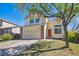 Charming two-story home featuring a spacious front yard and inviting red front door at 4965 Collinsville Pl, Highlands Ranch, CO 80130