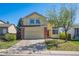 Charming two-story home featuring a spacious front yard and inviting red front door at 4965 Collinsville Pl, Highlands Ranch, CO 80130