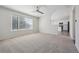 Cozy living room featuring a large window and open access to the kitchen at 4965 Collinsville Pl, Highlands Ranch, CO 80130