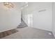Open living room features a staircase and ample natural light at 4965 Collinsville Pl, Highlands Ranch, CO 80130