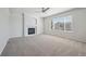 Open living room featuring a fireplace, ceiling fan, and large window at 4965 Collinsville Pl, Highlands Ranch, CO 80130