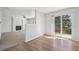 Bright living room with fireplace, ceiling fan, and sliding glass doors leading to a fenced yard at 4965 Collinsville Pl, Highlands Ranch, CO 80130