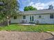 Backyard featuring a patio area with outdoor seating, ideal for relaxing and entertaining guests at 5319 E Davies Dr, Centennial, CO 80122