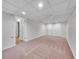 Spacious finished basement with neutral carpet, drop ceiling and closet at 5319 E Davies Dr, Centennial, CO 80122