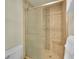 Bathroom featuring glass shower with tiled surround and a built-in bench at 5319 E Davies Dr, Centennial, CO 80122