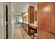 Bathroom featuring dual sink vanity, granite countertops, and large window at 5319 E Davies Dr, Centennial, CO 80122