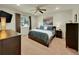 Spacious bedroom with ceiling fan, large window, and ample closet space at 5319 E Davies Dr, Centennial, CO 80122