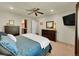 Bright bedroom featuring ceiling fan, and ensuite bathroom at 5319 E Davies Dr, Centennial, CO 80122
