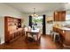 Charming dining area with lovely chandelier, wooden table, and hardwood floors at 5319 E Davies Dr, Centennial, CO 80122
