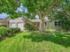Charming home with a well-maintained front yard and mature tree offering shade and beauty at 5319 E Davies Dr, Centennial, CO 80122