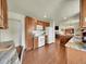 Open kitchen with granite countertops, custom cabinets and seamless access to living spaces at 5319 E Davies Dr, Centennial, CO 80122