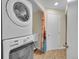 Stacked washer and dryer in laundry area at 5319 E Davies Dr, Centennial, CO 80122