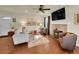 Inviting living room with fireplace, hardwood floors, and comfortable seating at 5319 E Davies Dr, Centennial, CO 80122