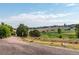 Scenic walking path for neighborhood residents with mature trees and open grassy spaces at 5319 E Davies Dr, Centennial, CO 80122