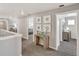 Upstairs hallway with artwork and access to bedrooms at 27621 E Cedar Ave, Aurora, CO 80018