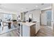 Bright kitchen island overlooks the dining and living areas, making it perfect for entertaining guests at 3297 N Duquesne Way, Aurora, CO 80019