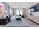 Inviting living room with stylish furniture, contemporary lighting, and ample space at 3297 N Duquesne Way, Aurora, CO 80019