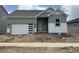 Charming single-story home with a modern garage door and stylish exterior paint at 138 S Seacrest St, Golden, CO 80401
