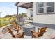 Cozy outdoor seating area featuring a stone fire pit perfect for relaxing evenings and entertaining guests at 138 S Seacrest St, Golden, CO 80401