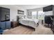 This bedroom features two large windows that provide natural light and plush carpeting at 16019 E Elk Dr, Denver, CO 80239
