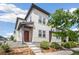 Contemporary two-story house with a red front door, modern landscaping, and neutral exterior paint at 16019 E Elk Dr, Denver, CO 80239