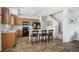 Open kitchen with wood cabinets, center island, and modern appliances offering functionality at 16019 E Elk Dr, Denver, CO 80239