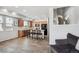 Open-concept kitchen with wood cabinets, stainless steel appliances, and center island with bar stools at 16019 E Elk Dr, Denver, CO 80239