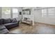Modern living room featuring a floating entertainment console and neutral decor at 16019 E Elk Dr, Denver, CO 80239