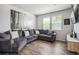 Comfortable living room showcases a plush sectional sofa and modern decor at 16019 E Elk Dr, Denver, CO 80239