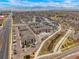 Overhead of the property with views of the mountains, neighborhood and surrounding commercial areas at 15345 W 64Th Ln # 107, Arvada, CO 80007