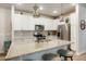 Modern kitchen featuring granite countertops, stainless steel appliances, and a functional island at 15345 W 64Th Ln # 107, Arvada, CO 80007