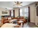 Well-lit living room with comfortable leather seating, modern decor, and an open layout at 15345 W 64Th Ln # 107, Arvada, CO 80007