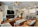 Open-concept living area connecting to the kitchen with a fireplace and stylish furnishings at 15345 W 64Th Ln # 107, Arvada, CO 80007