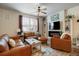 Cozy living room featuring a fireplace, modern furniture, and ample natural light at 15345 W 64Th Ln # 107, Arvada, CO 80007