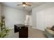 A bright office space with a ceiling fan and carpet creates a great work environment at 15345 W 64Th Ln # 107, Arvada, CO 80007