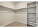 A walk-in closet with shelving and clothing racks providing ample storage solutions at 15345 W 64Th Ln # 107, Arvada, CO 80007