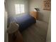 Well-lit bedroom with hardwood floors, a window, and classic decor at 12235 E 2Nd Dr, Aurora, CO 80011
