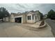 Beautiful home featuring a spacious garage, manicured landscaping, and charming curb appeal at 12235 E 2Nd Dr, Aurora, CO 80011