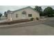 Inviting home featuring a well-maintained exterior with lovely landscaping, and a charming entrance at 12235 E 2Nd Dr, Aurora, CO 80011