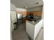 Modern kitchen with stainless steel appliances, wooden cabinets, and stylish countertops at 12235 E 2Nd Dr, Aurora, CO 80011