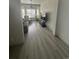 Cozy living room with neutral walls and hardwood-style floors at 12235 E 2Nd Dr, Aurora, CO 80011