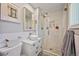 Modern bathroom featuring glass enclosed shower, white tile and vessel sink at 1733 S Urban Way, Lakewood, CO 80228