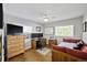 Bright bedroom offering ample space for work and rest, featuring hardwood floors, natural light and a ceiling fan at 1733 S Urban Way, Lakewood, CO 80228
