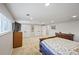 Large bedroom featuring multiple closets, built-in bookshelves, offering plenty of storage, plus natural light at 1733 S Urban Way, Lakewood, CO 80228