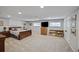 Spacious bedroom with a bed, built-in bookshelves, TV, and ample closet space for comfortable living at 1733 S Urban Way, Lakewood, CO 80228